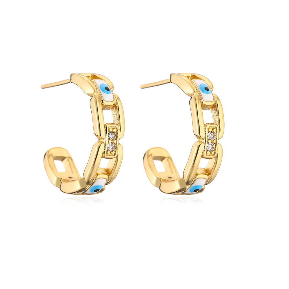Orecchini geometrici in rame placcato oro con smalto a forma di occhio per donna