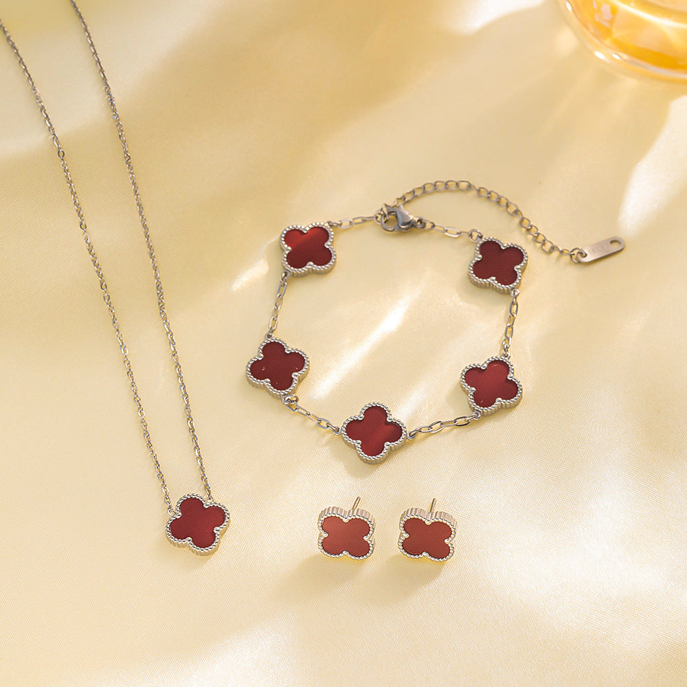 Set di collana, bracciale e orecchini a lobo da donna in acciaio al titanio minimalista con quadrifoglio fortunato