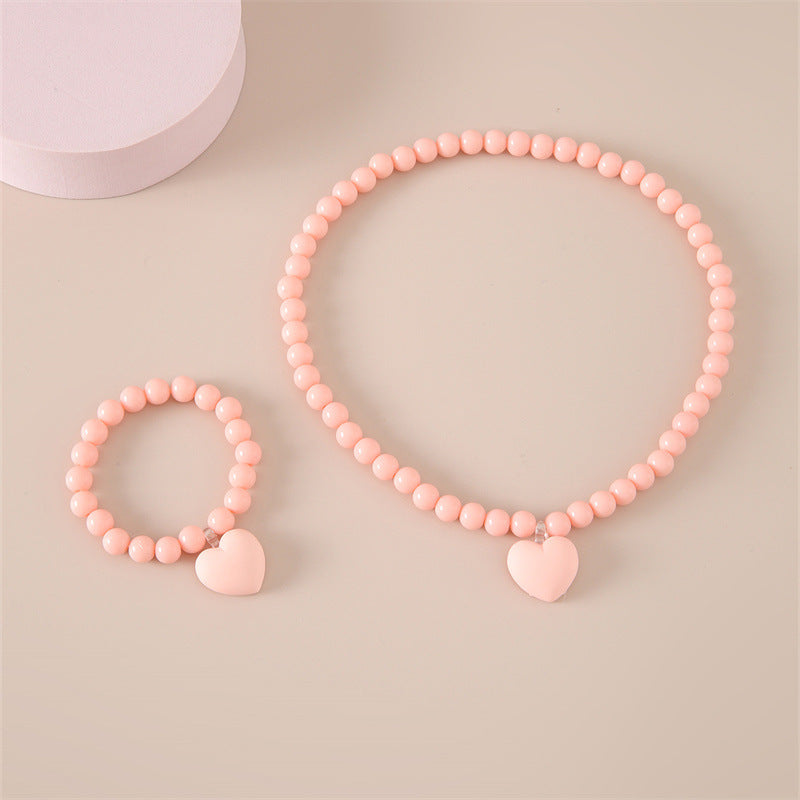 Set collana con ciondolo acrilico a cuore minimalista per bambini con catena di perline di plastica