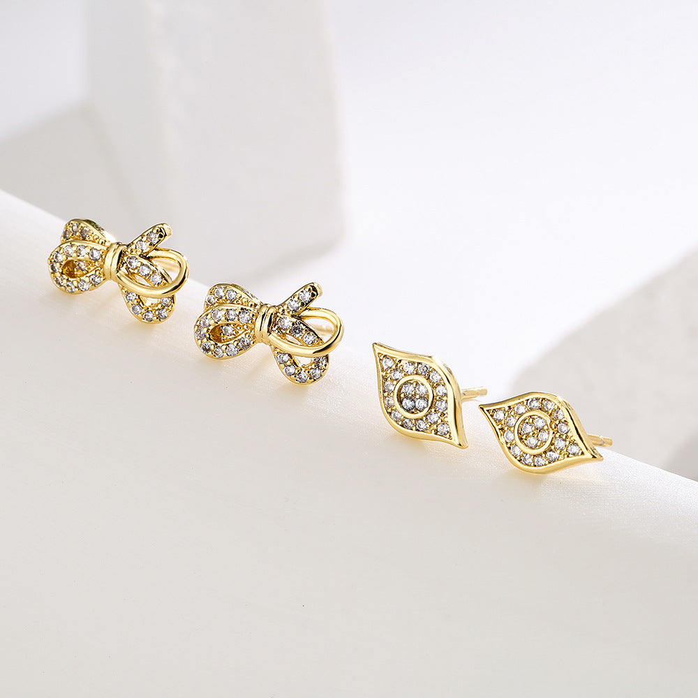 Minimalist Bowknot-Shaped Copper Earrings with 18K Gold Plating and Micro-Pavé Zirconia Eye Detail