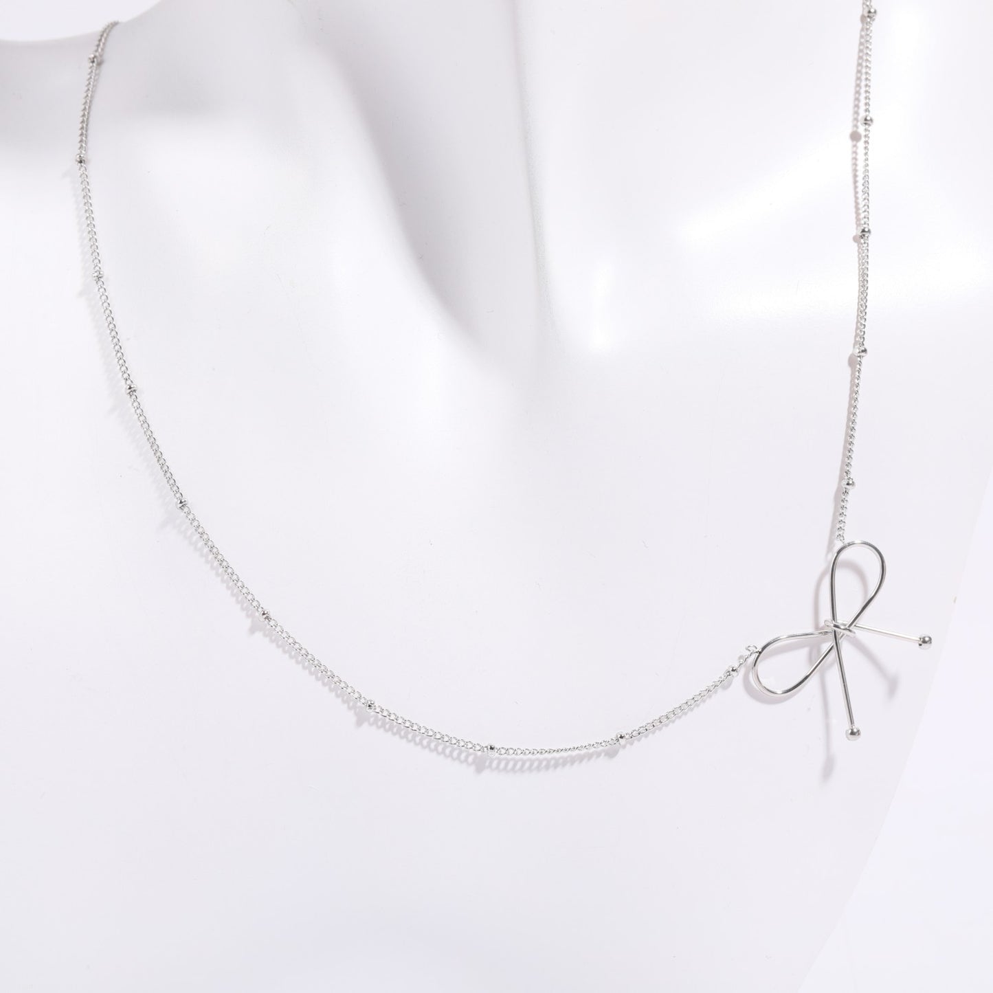 Parure Collana e Bracciale da Donna con Fiocco in Acciaio al Titanio Placcato Oro 18K