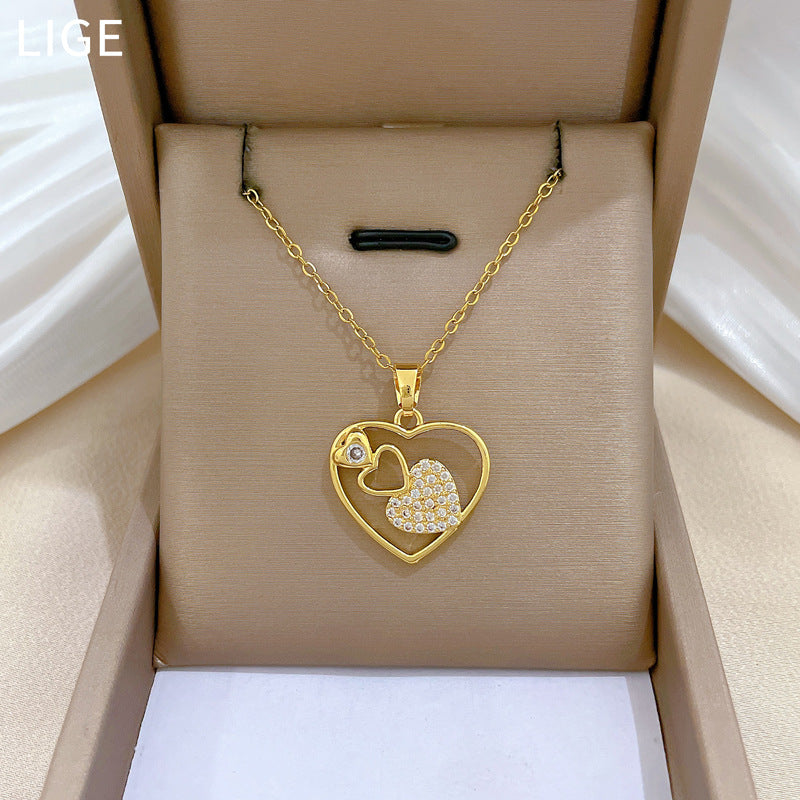 Collana con ciondolo a cuore geometrico minimalista e cavo per donna in acciaio al titanio con accenti di strass