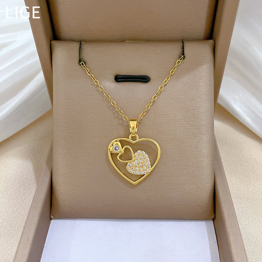 Collar minimalista de corazón hueco geométrico para mujer en acero de titanio con detalles de diamantes de imitación
