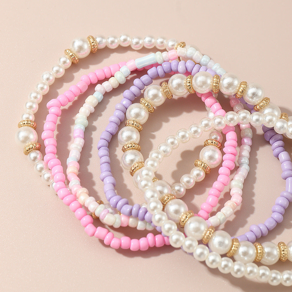 Set de pulseras de cuentas de cristal geométricas minimalistas para niñas en colores pastel rosa y morado