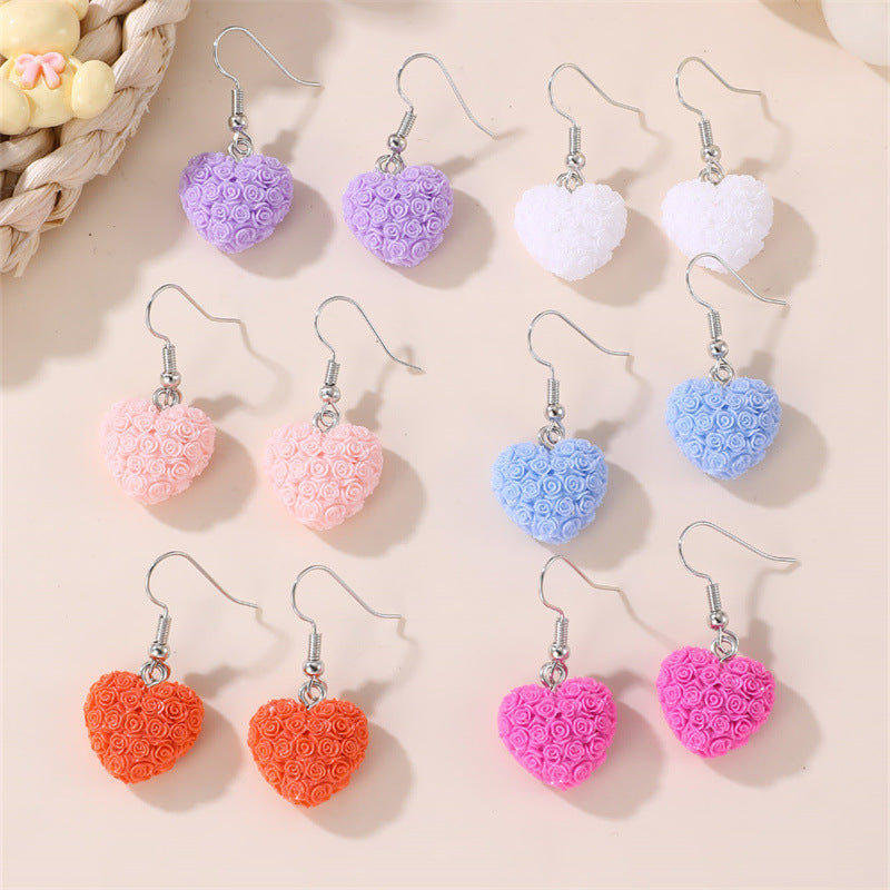 Set de aretes infantiles minimalistas con corazón floral, estrella y moño para niñas de 3 a 10 años, aretes de plástico y resina con incrustaciones de perlas