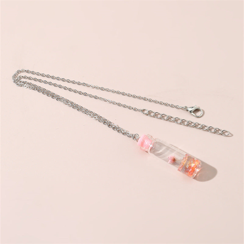 Collar con colgante de cristal geométrico minimalista para niños con flores secas rosas y encapsulación de resina