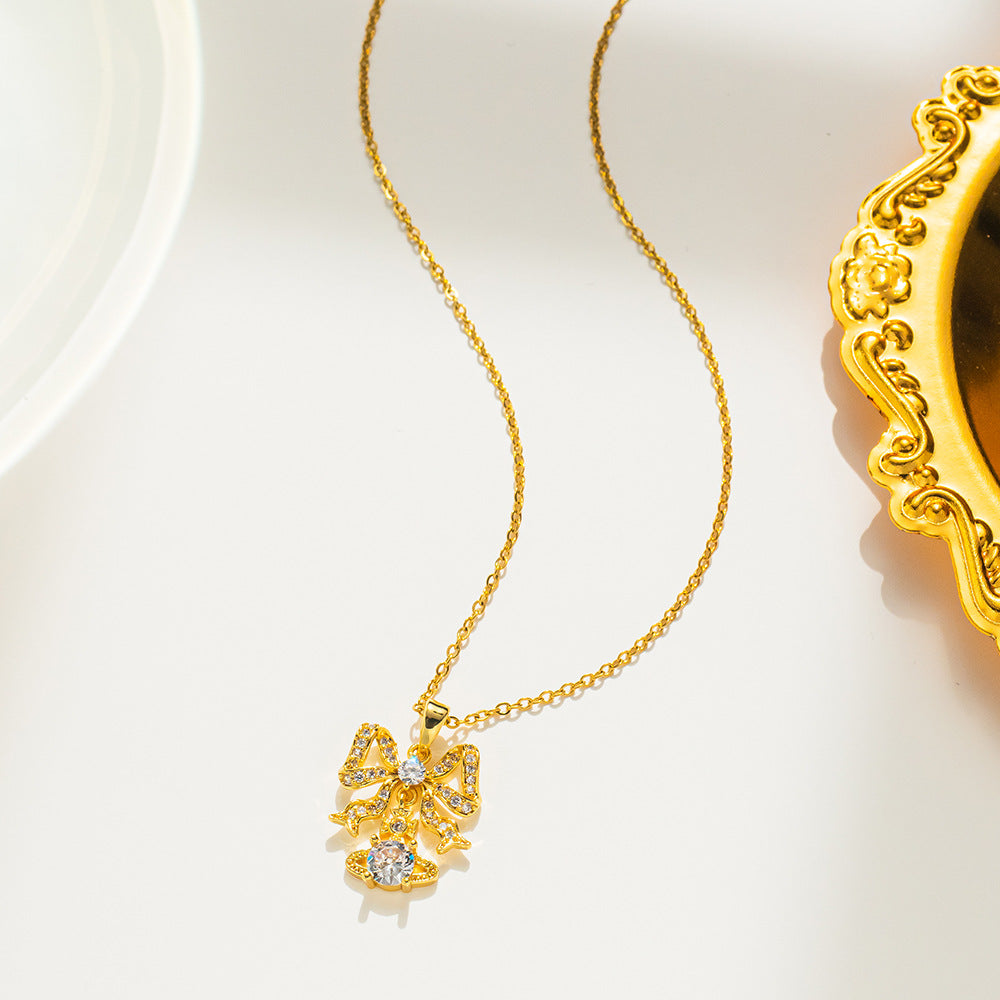 Collana da donna a forma di fiocco minimalista in acciaio al titanio con intarsio di strass, catena a O, delicato gioiello per la clavicola
