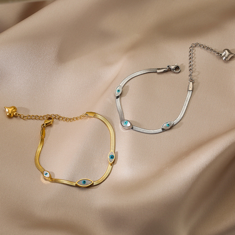 Bracciale minimalista a occhio di Allah in acciaio al titanio con pavé per donna