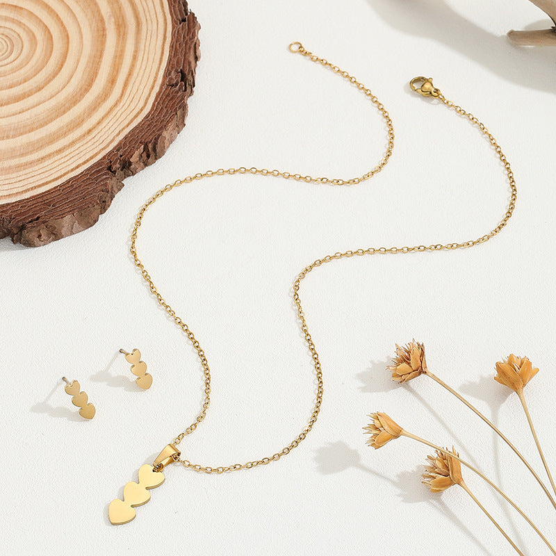 Conjunto de collar y pendientes chapados en cobre con forma de corazón minimalista y borlas para mujer