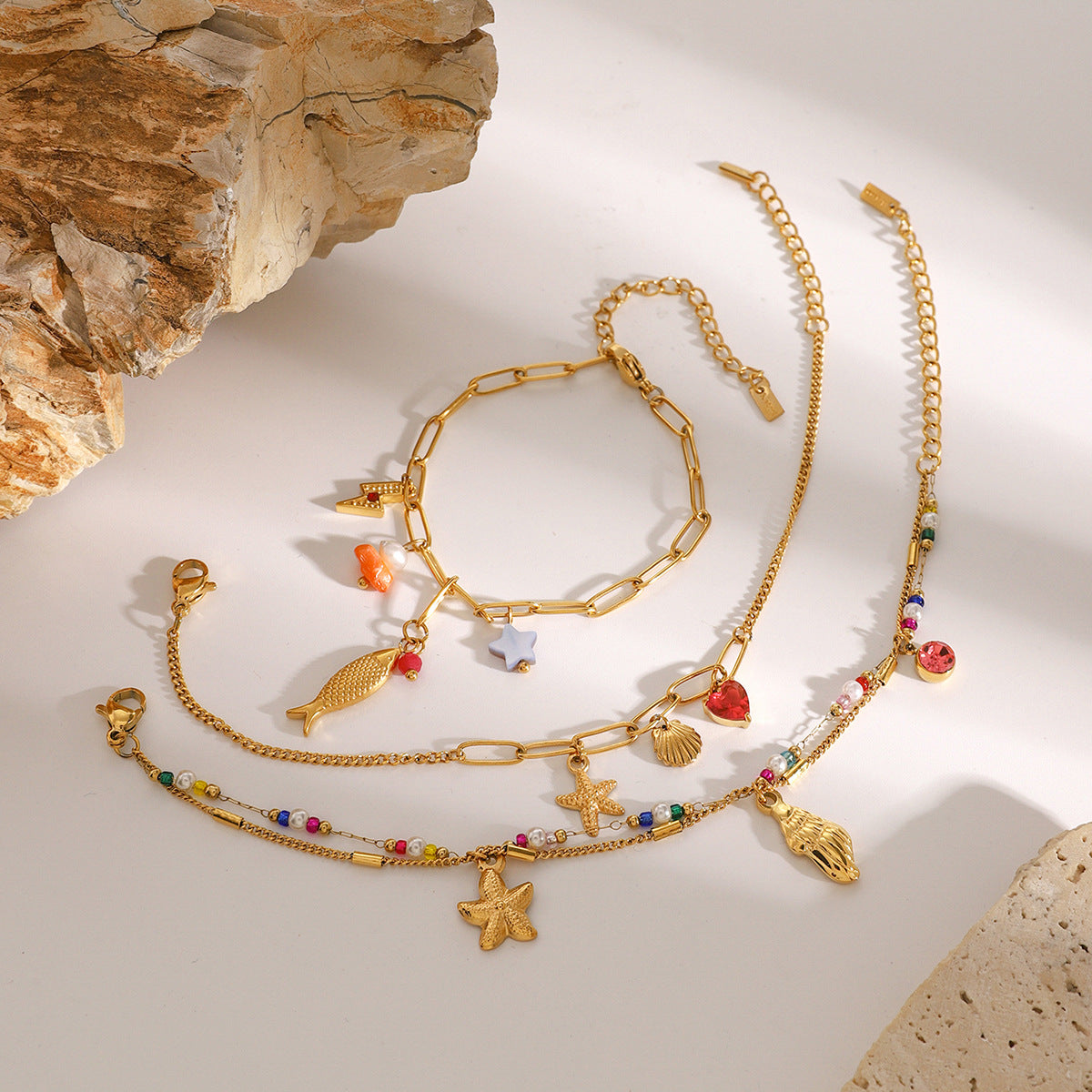 Bracciale da donna con ciondolo a barra in acciaio al titanio placcato oro 18 carati a forma di animale geometrico