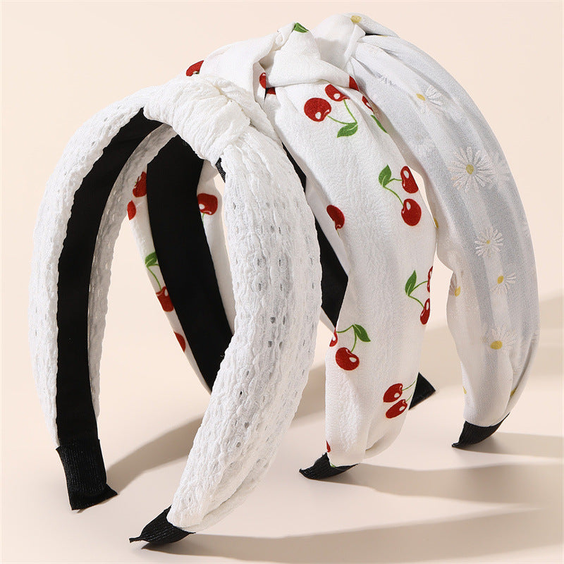 Diadema de tela ancha con estampado floral dulce para niñas con ribete de encaje y diseño geométrico