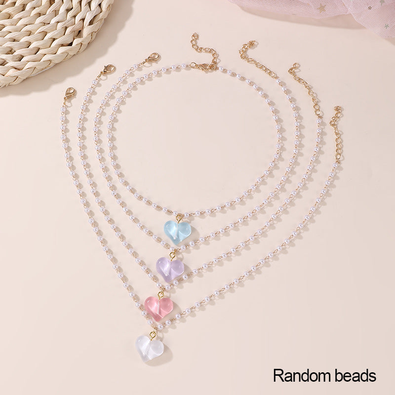 Conjunto de collar minimalista de lazo y corazón para niñas con colgante de resina en cadena de cuentas Colección de Verano