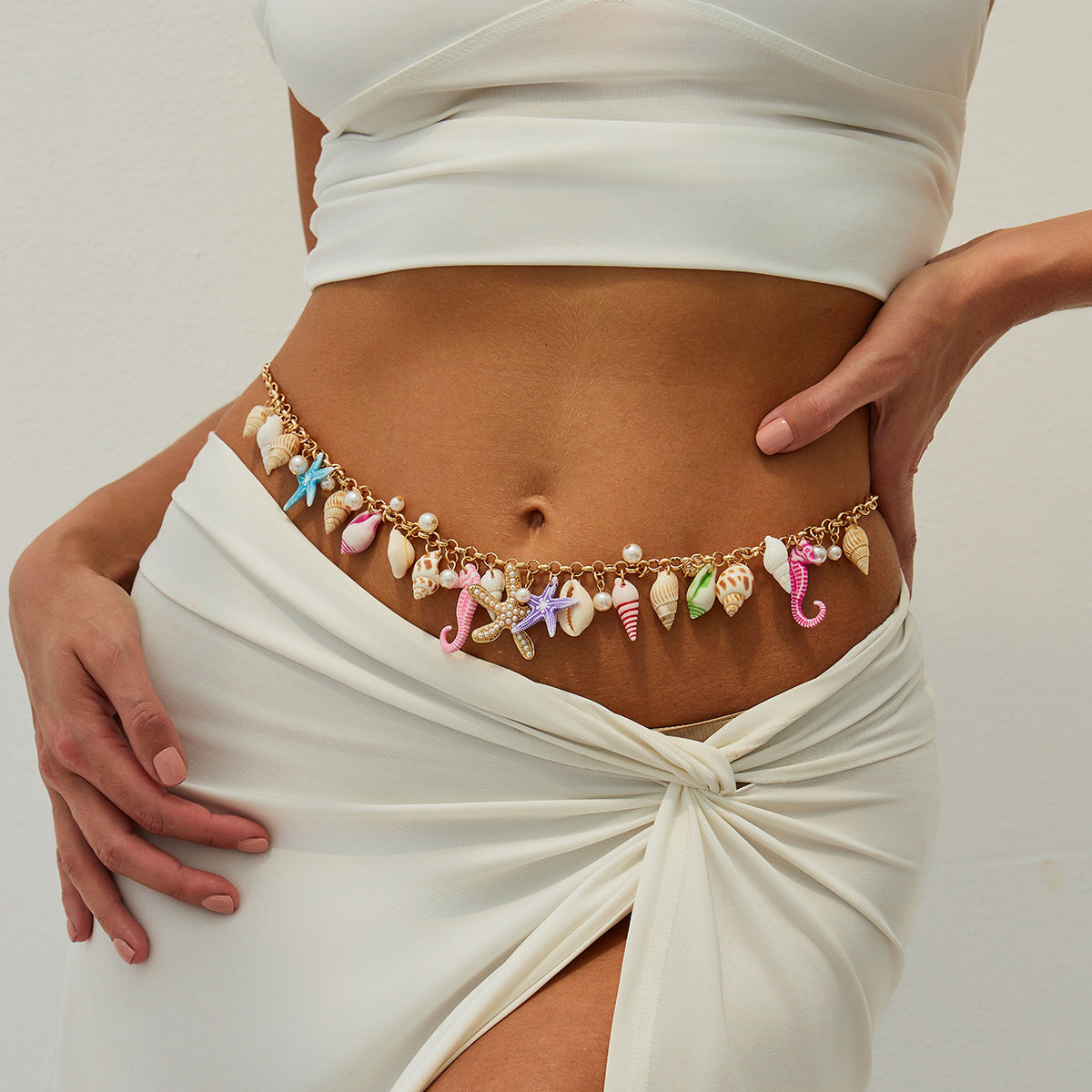 Cinturón de cadena metálica con forma de estrella de mar minimalista para mujer, con detalles de perlas de imitación y cierre de mosquetón