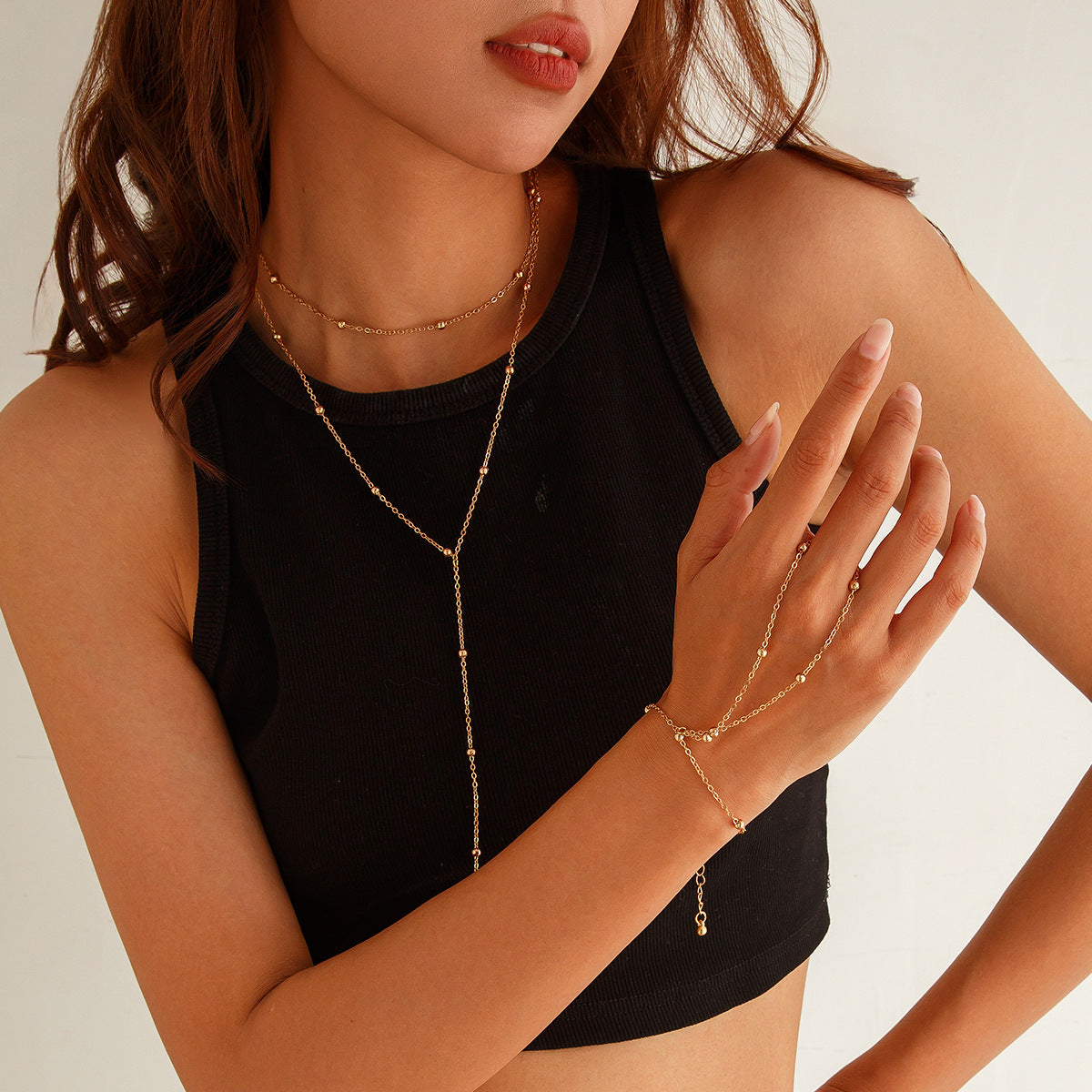 Set collana con ciondolo a sfera con nappa geometrica minimalista con catena in rame placcato e bracciale lungo a strati