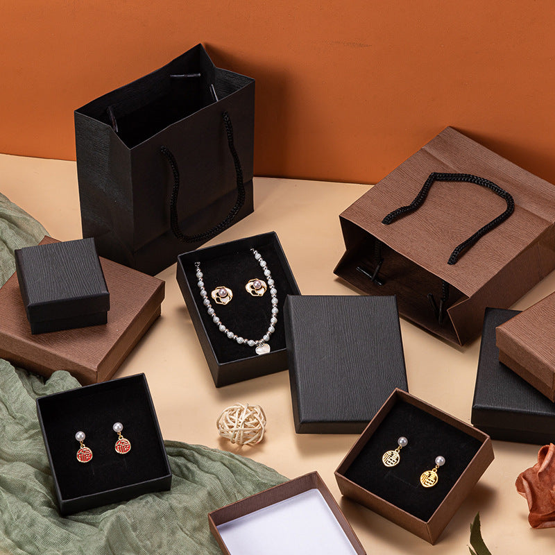 Caja de joyería de madera vintage con vetas para pendientes, collares, pulseras y anillos, con forro de terciopelo. Opciones en negro y marrón.