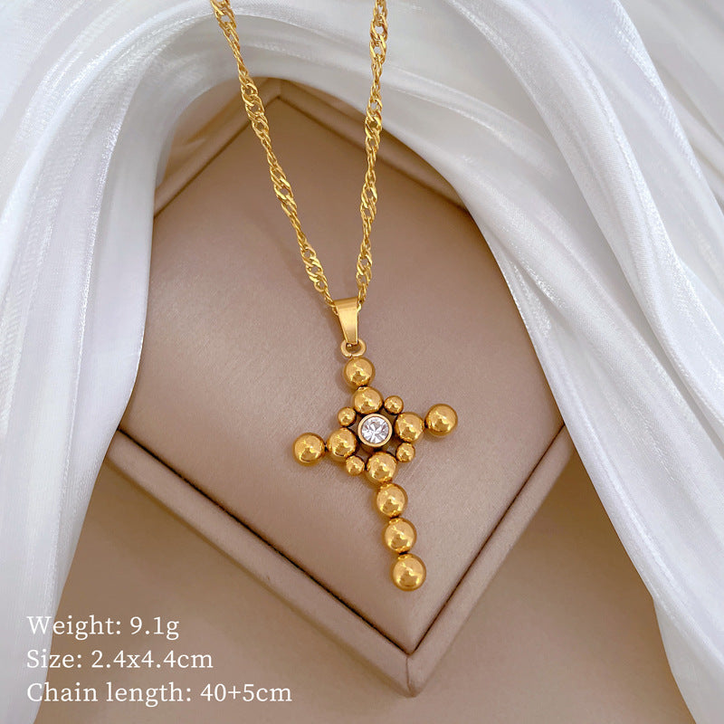 Collana Pendente a Croce con Catena a Sfera Minimalista in Acciaio al Titanio con Dettaglio Floreale Placcato Oro