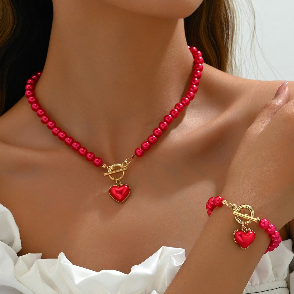 Juego de collar y pulsera minimalistas de aleación en forma de corazón con incrustaciones de perlas para mujer