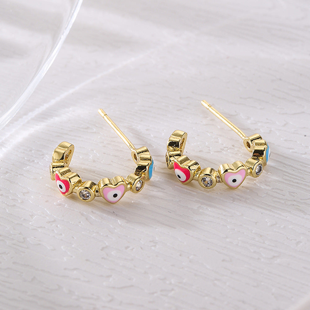 Geometric Style Copper Earrings with 18K Gold Plating and Micro-Paved Zirconia Heart-Eye C-Shaped Design for Women