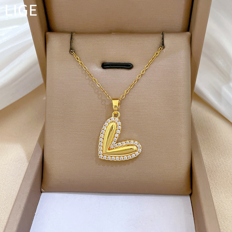 Collana minimalista da donna in acciaio al titanio a forma di cuore, con finitura lucida e intarsio di strass