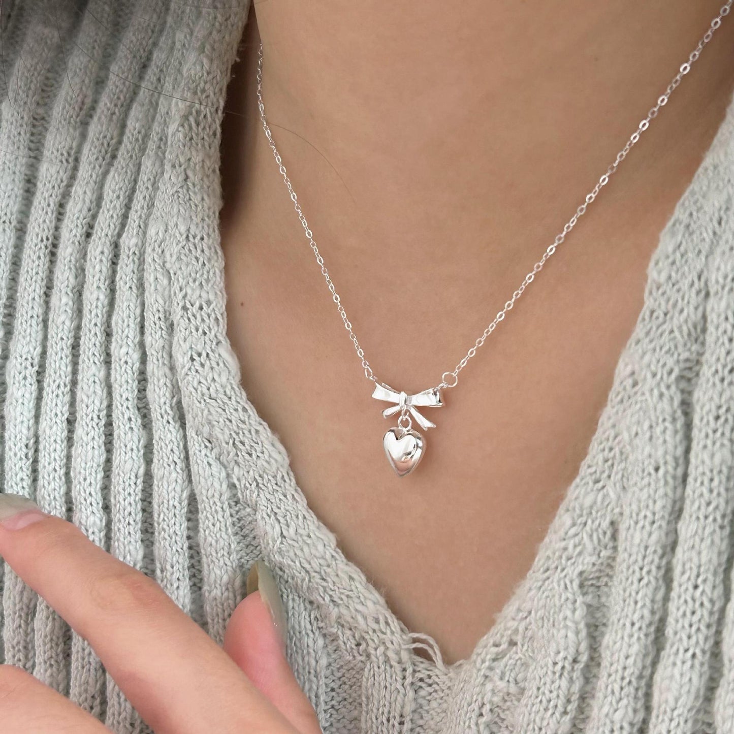Minimalist Heart and Bow Pendant Necklace in 925 Sterling Silver with Gold Plating on Cross Chain