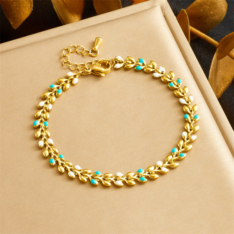 Bracciale da donna placcato oro minimalista in acciaio inossidabile con charm a foglia