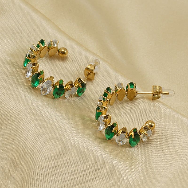Orecchini a perno da donna alla moda geometrici in acciaio al titanio placcato oro 18K con zirconi