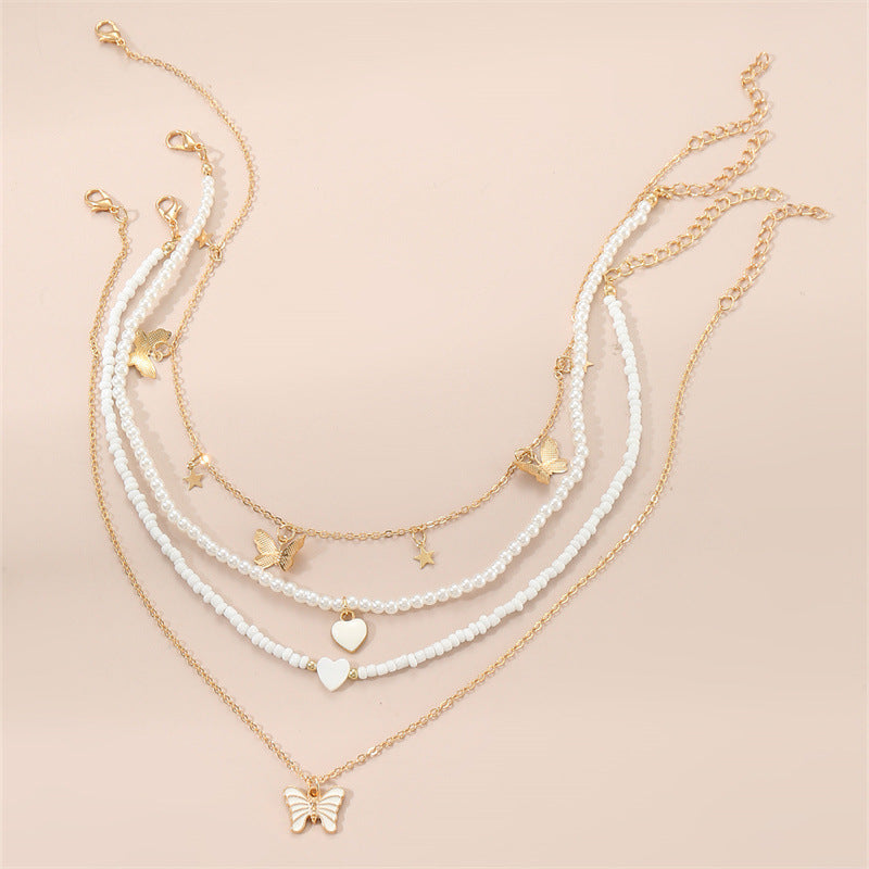 Bonito collar con dije de aleación esmaltado en forma de corazón para niños con cadena de eslabones torcidos