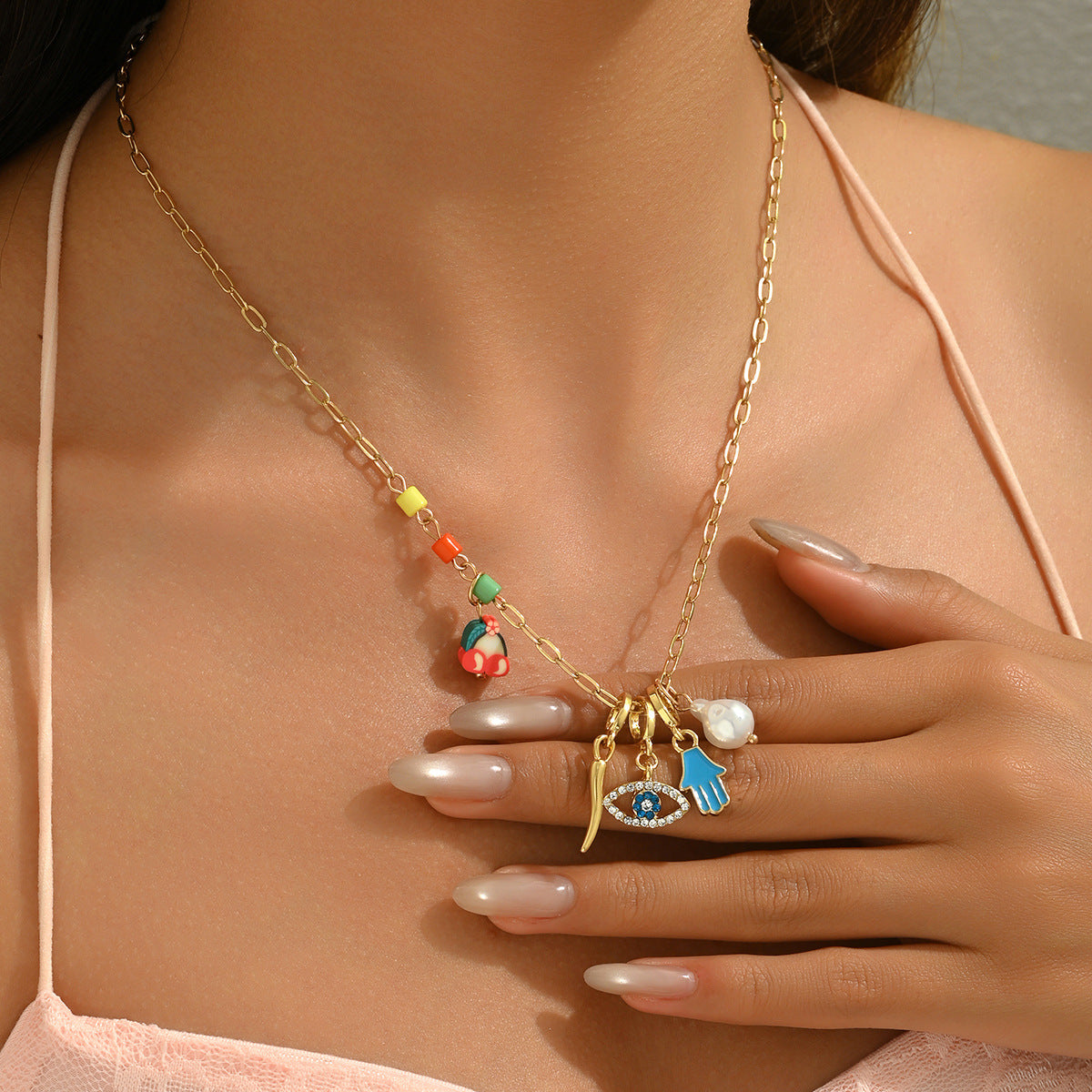 Collana pendente a forma di occhio alla moda da donna in smalto con intarsio di strass su catena di rame