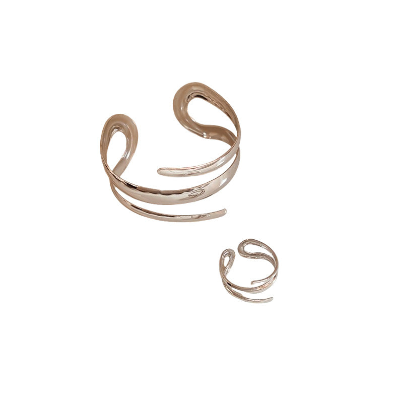 Elegante bracciale in metallo a fascia aperta geometrico con design a linee traforate per donna