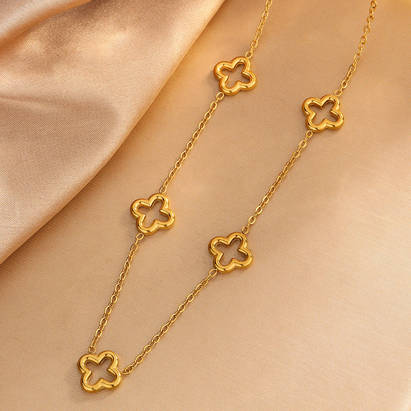 Conjunto de collar, pulsera y pendientes chapados en acero inoxidable con diseño floral hueco elegante de moda para mujer