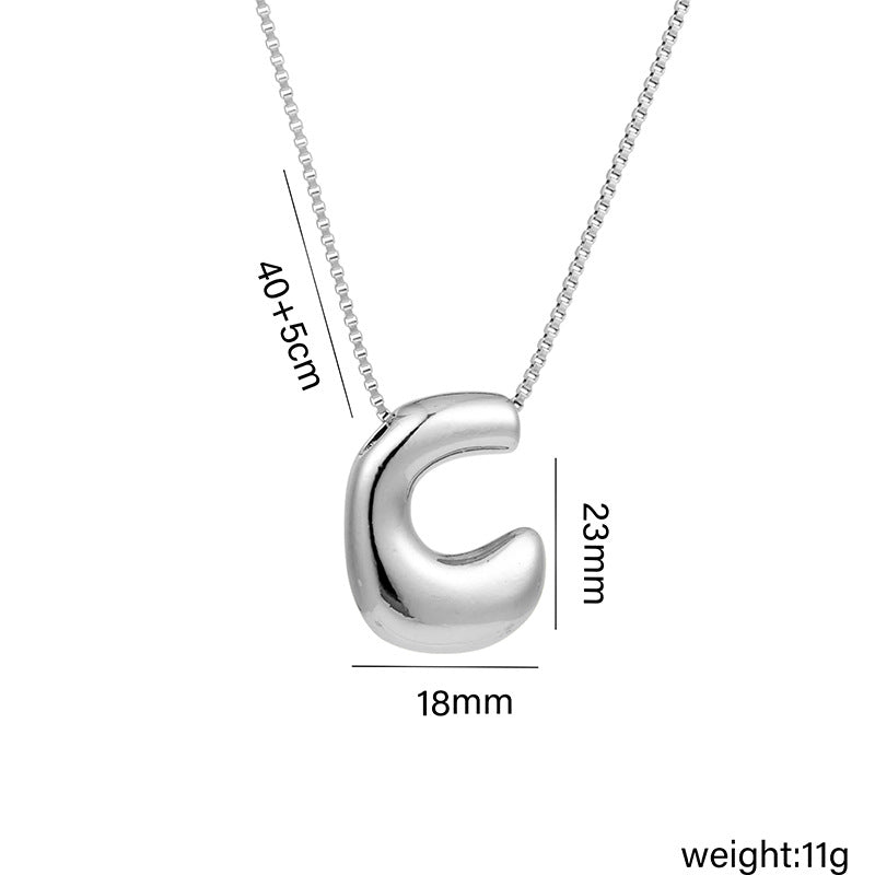 Collar con colgante de acero titanio con forma de letra minimalista y chapado en oro para mujer