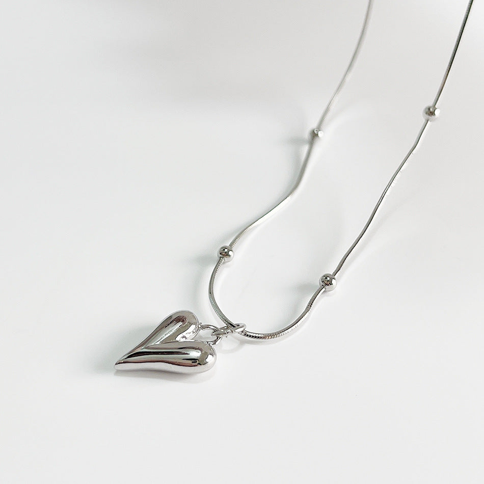 Collana da donna minimalista con ciondolo geometrico a cuore tondo in argento sterling 925