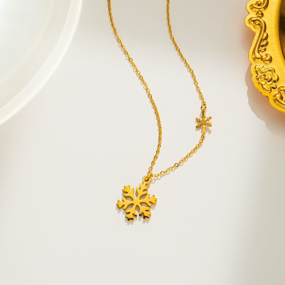 Collana con ciondolo a fiocco di neve minimalista in acciaio al titanio placcato oro 18K da donna, catena con medaglione dal design geometrico
