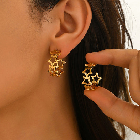 Elegantes pendientes huecos de acero inoxidable con diseño floral de trébol de cuatro hojas y estrella con acabado PVD de oro de 18 quilates para mujer