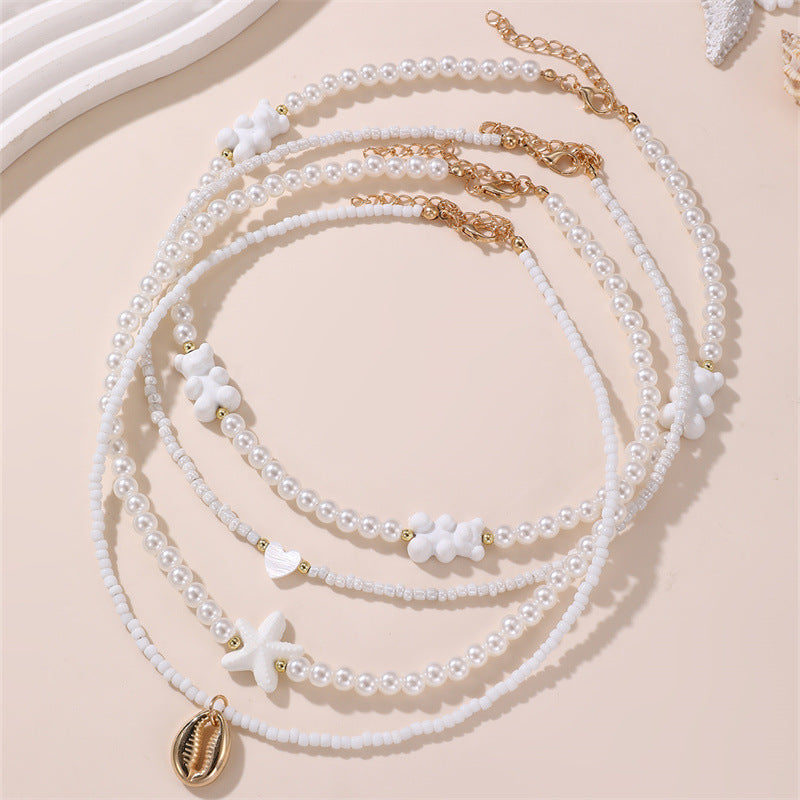Collana Minimalista con Ciondolo a Fiocco a Farfalla per Bambini con Perline Rosa in Vetro su Catena di Perline Rotonde