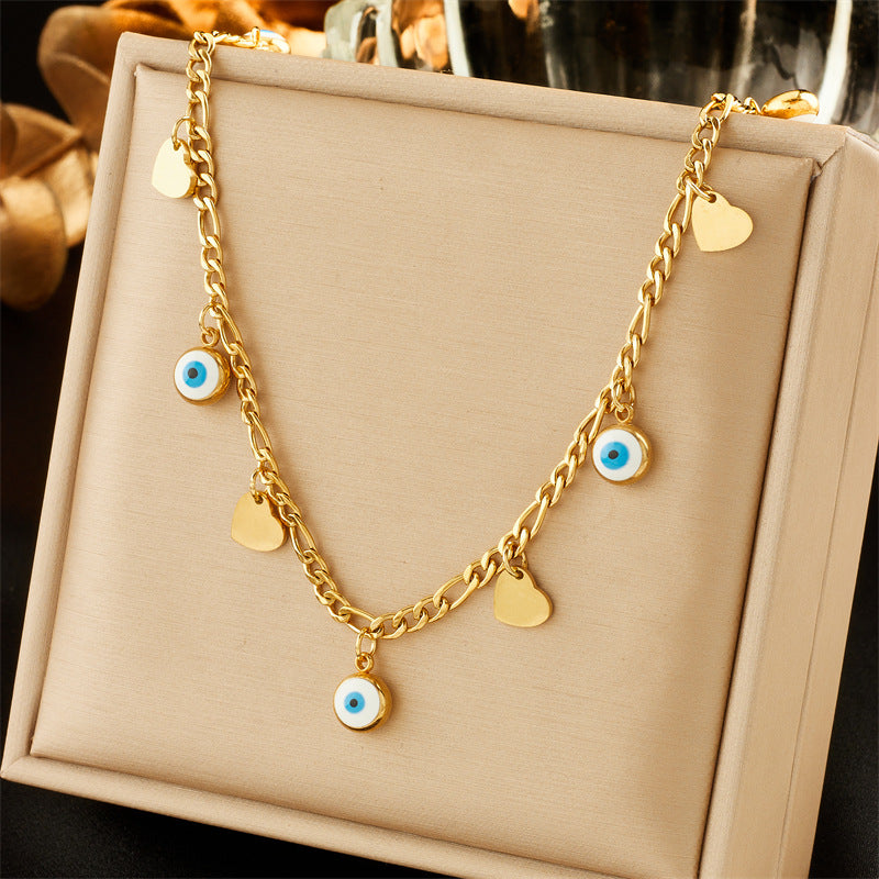 Collar con colgante minimalista de acero inoxidable con forma de corazón, incrustaciones de pedrería y cadena de cuentas de colores