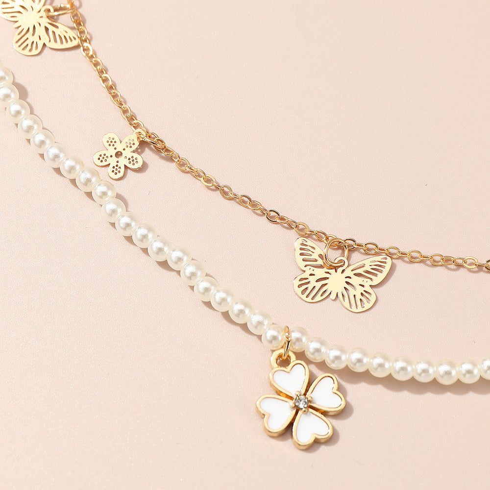 Collar minimalista de aleación con forma de mariposa y cadena de perlas para niñas de 6 años en adelante, collar con colgante de trébol de cuatro hojas y cuentas