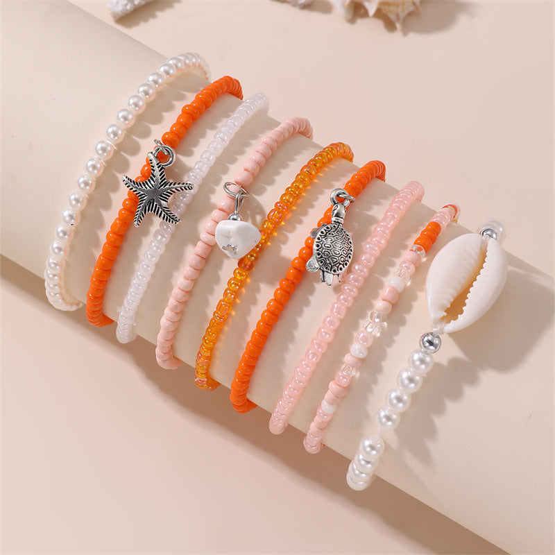 Pulsera de cristal con forma de estrella de mar, minimalista, para niñas, con acabado artesanal y diseño inspirado en el océano.
