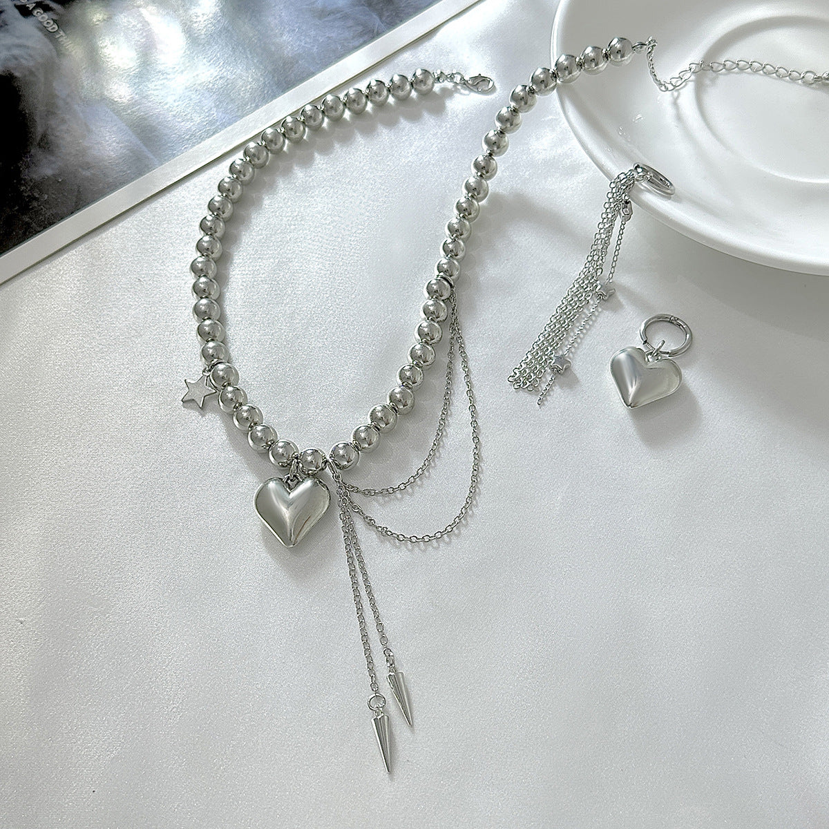 Girocollo con pendente a stella e cuore dolce e audace con nappe da donna