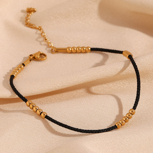 Tobillera Minimalista Geométrica de Acero Inoxidable con Baño de Oro de 18K y Cordón Negro Acentuada con 25 Cuentas de Acero