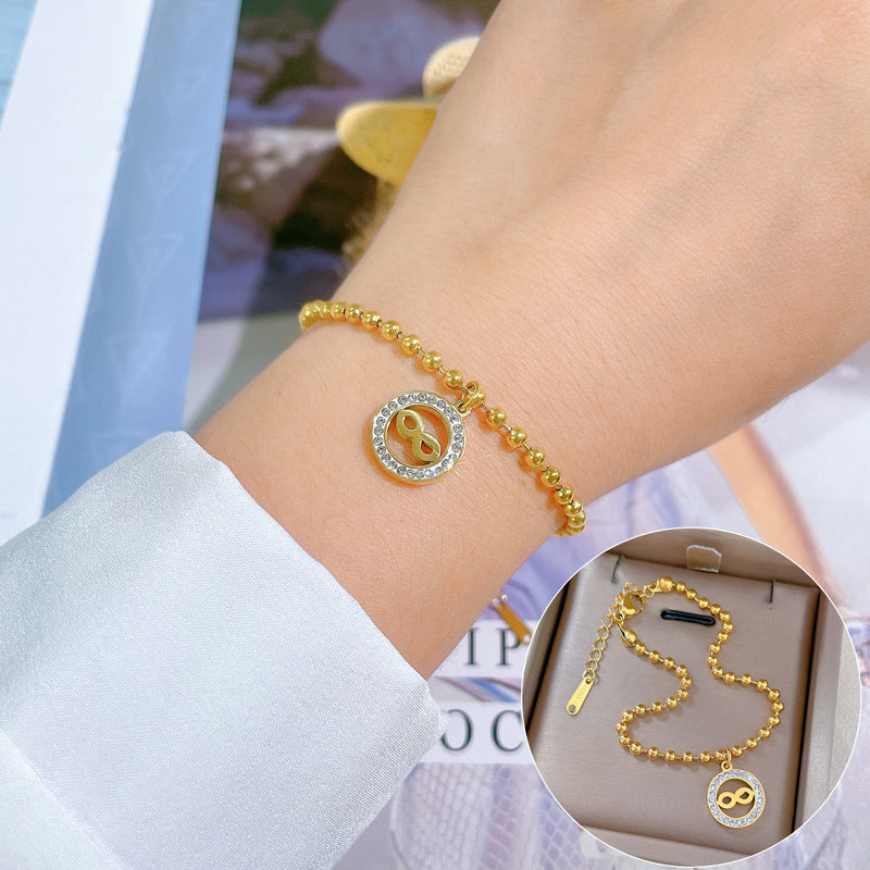 Bracciale da donna in stile vintage con cerchio di perline, realizzato in acciaio al titanio con placcatura in oro e texture ondulata
