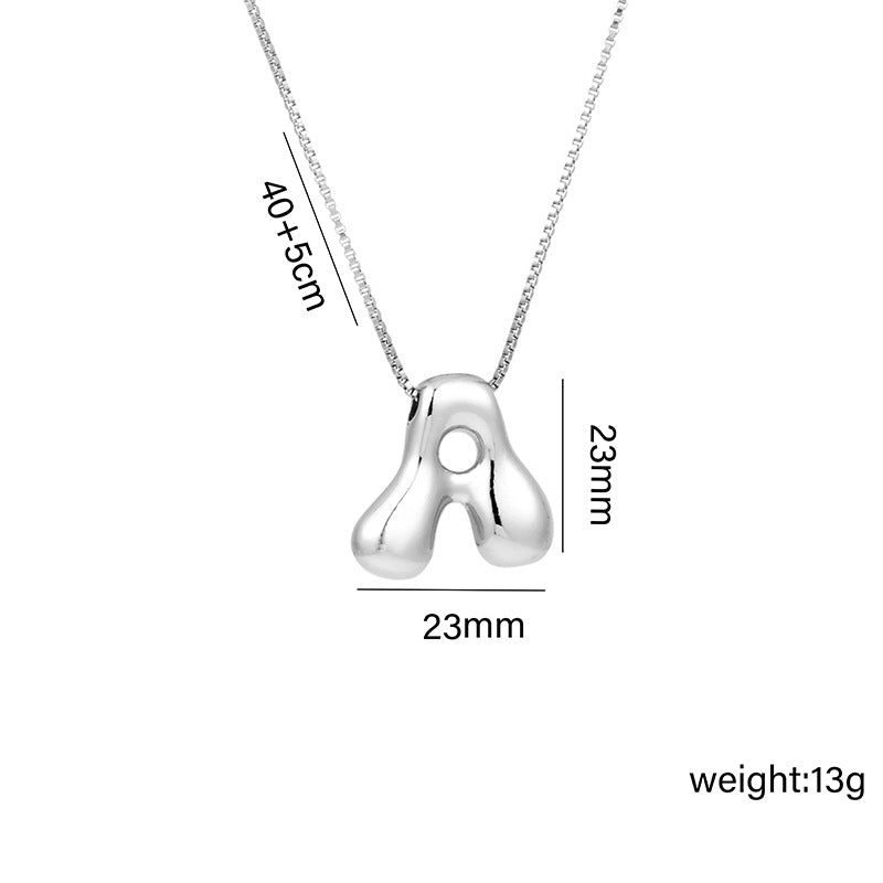 Collar con colgante de acero titanio con forma de letra minimalista y chapado en oro para mujer