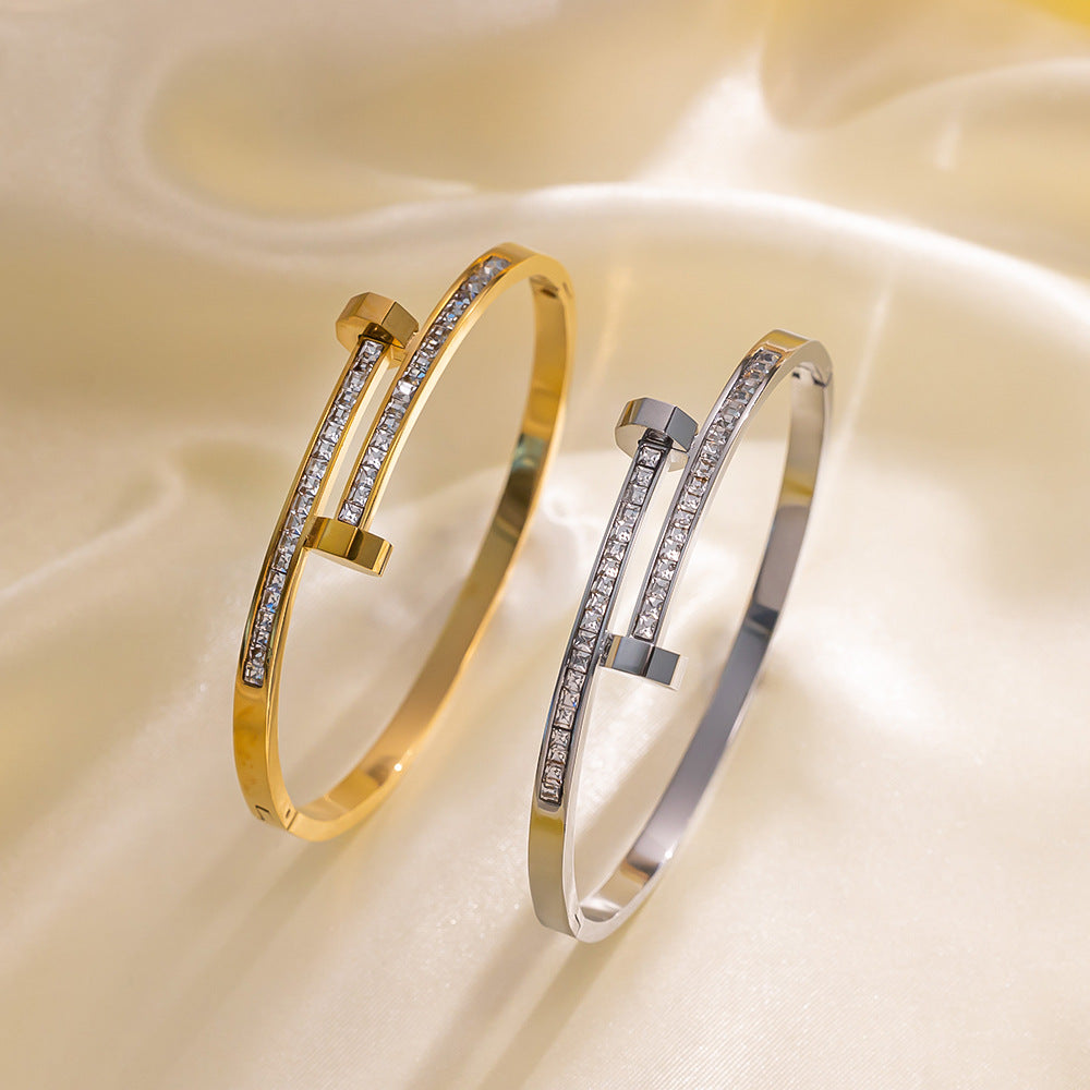 Bracciale minimalista geometrico in acciaio al titanio con zirconi micro-pavé da donna