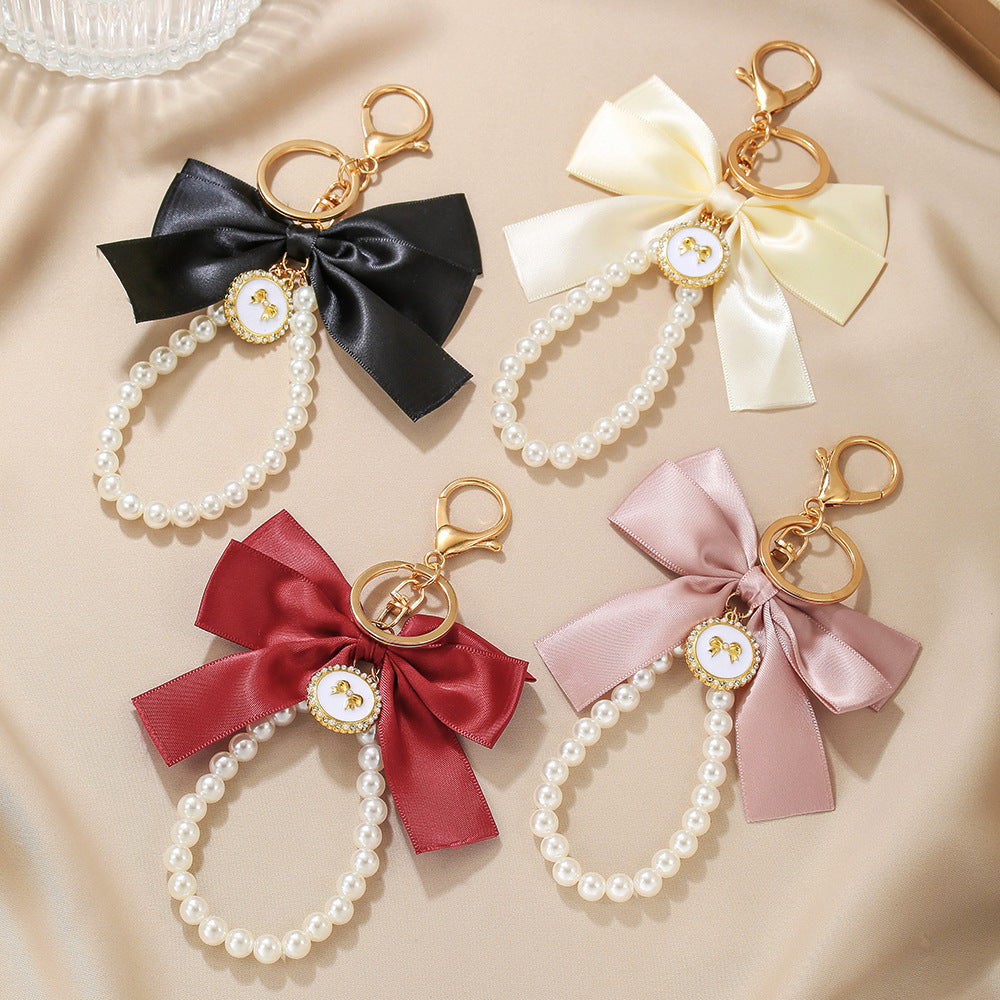 Sweet Cartoon Bow Pearl Zinc Alloy Keychain Bag Charm