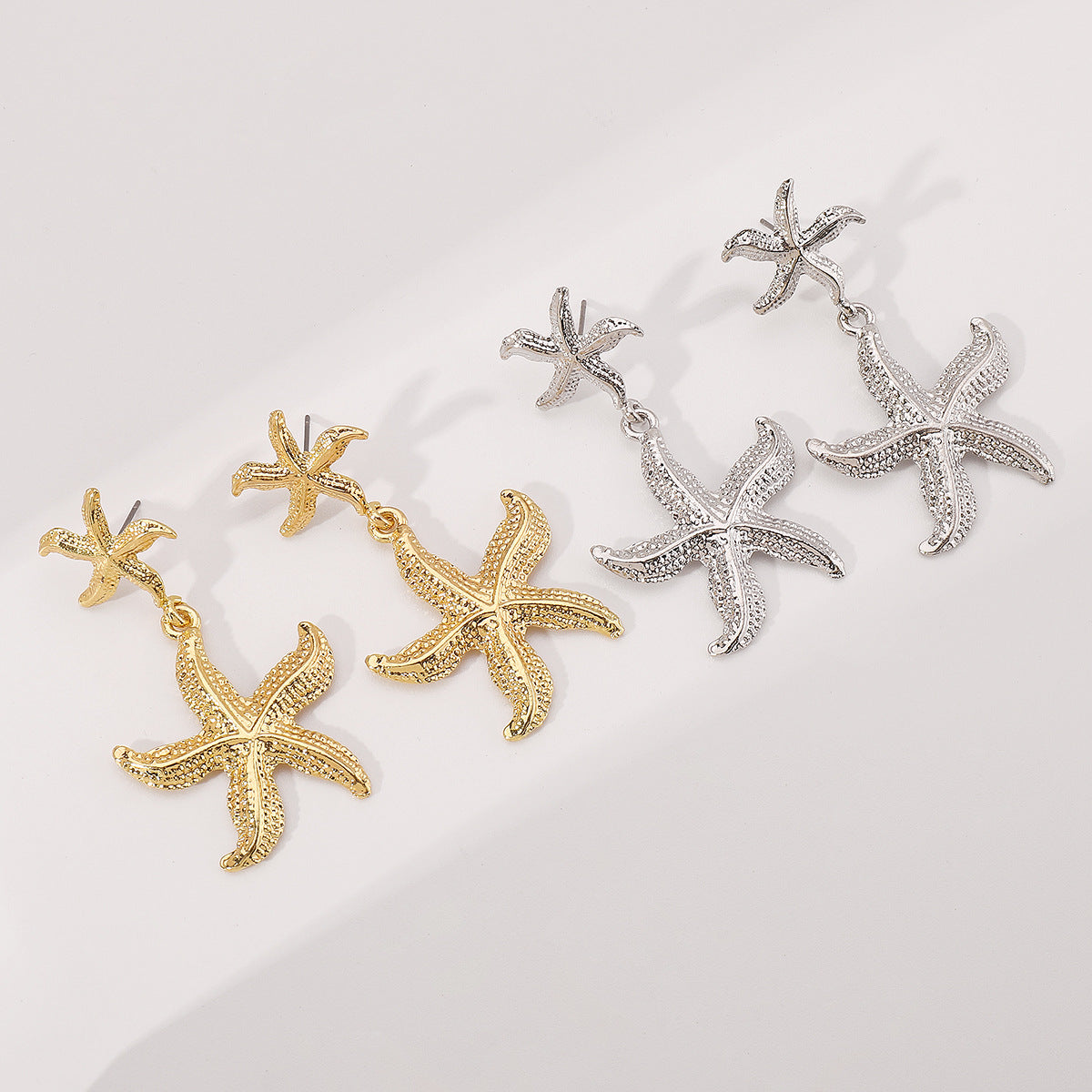 Pendientes Retro Minimalistas con Forma de Estrella de Mar de Aleación con Acabado Chapado para Mujer