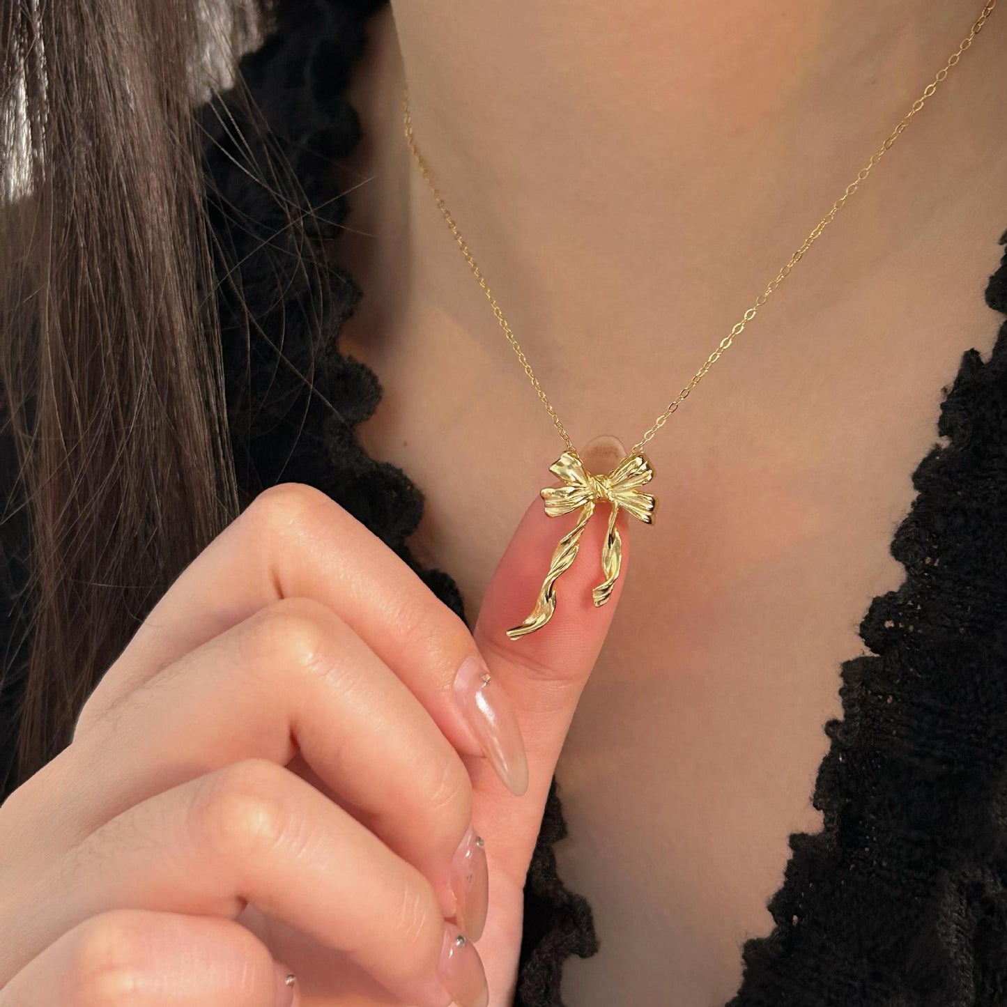 Minimalist Bow-Shaped Pendant Necklace in Sterling Silver with Gold Plating on Cross Chain