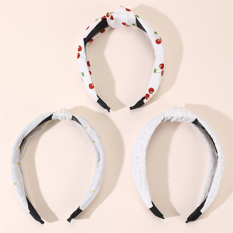 Diadema de tela ancha con estampado floral dulce para niñas con ribete de encaje y diseño geométrico