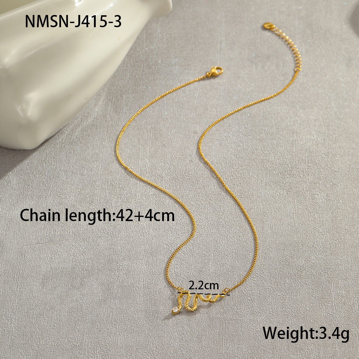 Collar de acero de titanio con forma de serpiente a la moda con incrustaciones de diamantes de imitación y colgante de flecos para mujer
