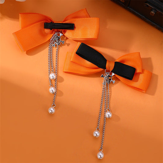 Precioso juego de pinzas para el pelo de niña con forma de lazo, cadena con borla y detalles de perlas