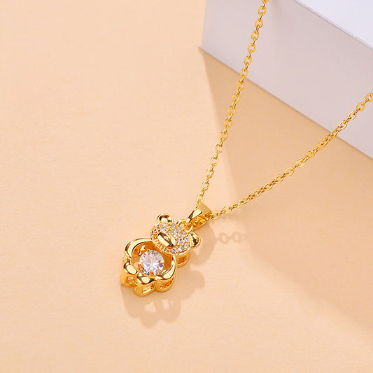 Collana con ciondolo a orsetto carino per donna in acciaio al titanio placcato oro con catena a maglie lunghe e design floreale irregolare